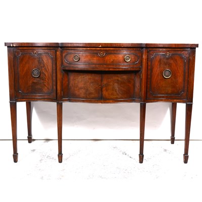 Lot 360 - George II style mahogany serpentine sideboard.