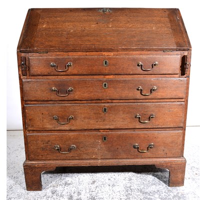 Lot 513 - A George III oak bureau, ...