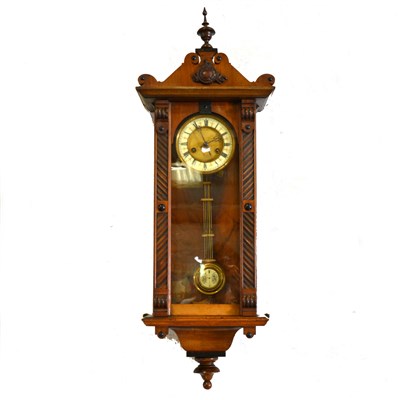 Lot 572 - Walnut Vienna type wall clock, carved case, circular dial, the movement striking on a gong.