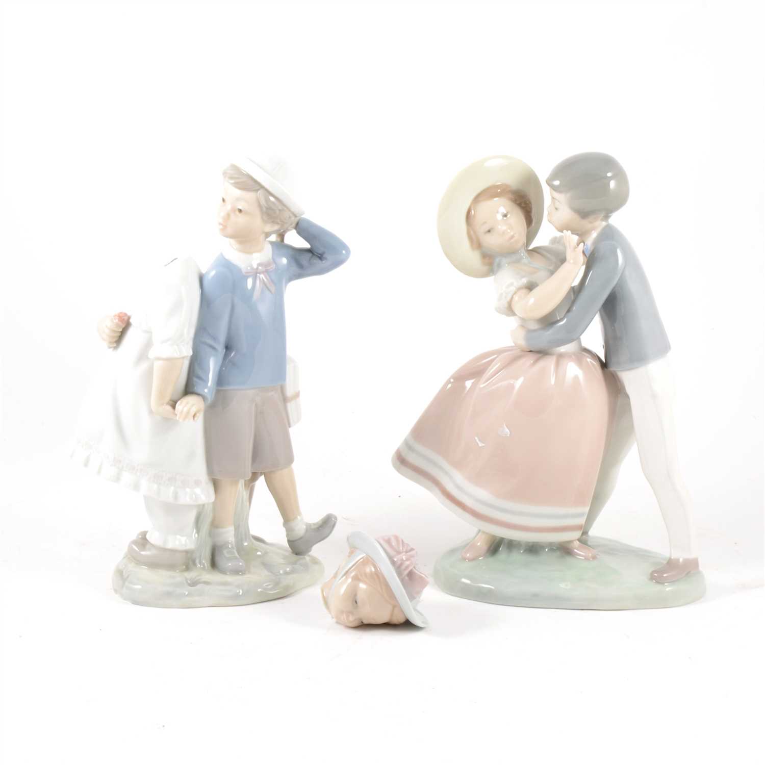 Lot 21 - A Lladro group of a boy and girl, ...