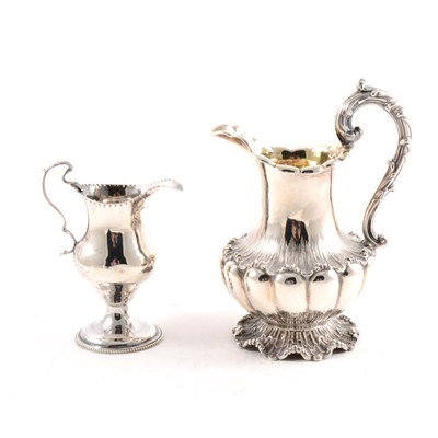Lot 188 - A Victorian silver cream jug and a William IV silver creamer jug