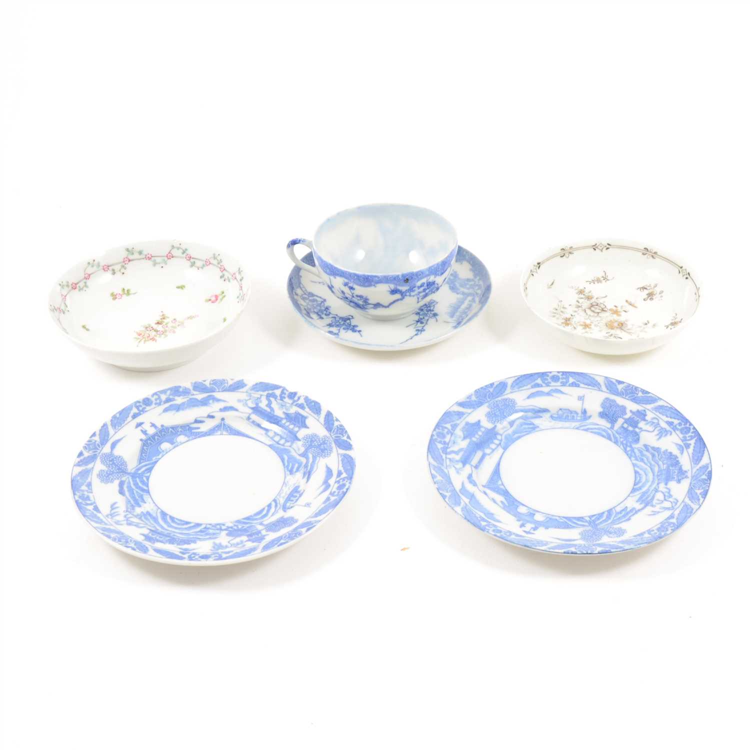 Lot 11 - A late Chinese blue and white cup and saucer, and a collection of English porcelain saucers