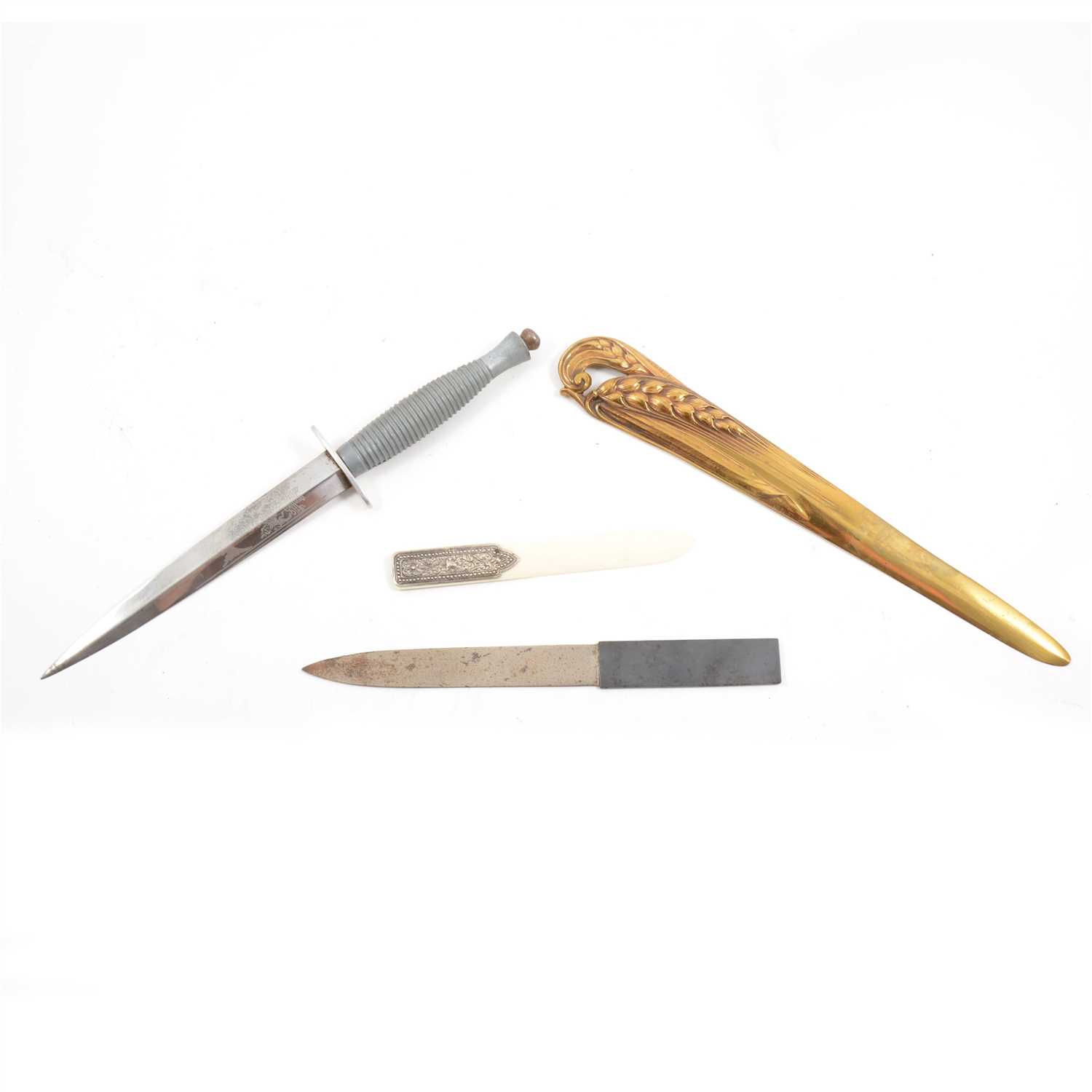 Lot 178 - Military dagger, French gilt bronze paper slicer, Heidelberg dagger and an ivory paper slicer with embossed white metal haft.