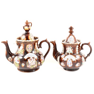 Lot 43 - A Victorian bargeware teapot W. BARNES, GT. GLENN, 1882, and another similar.