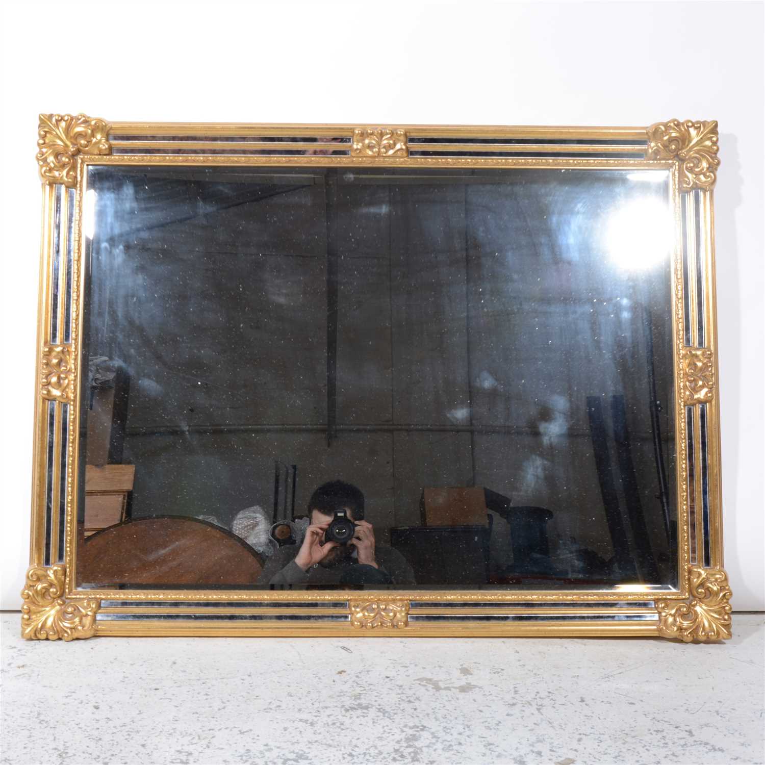 Lot 327 - A reproduction gilt framed wall mirror