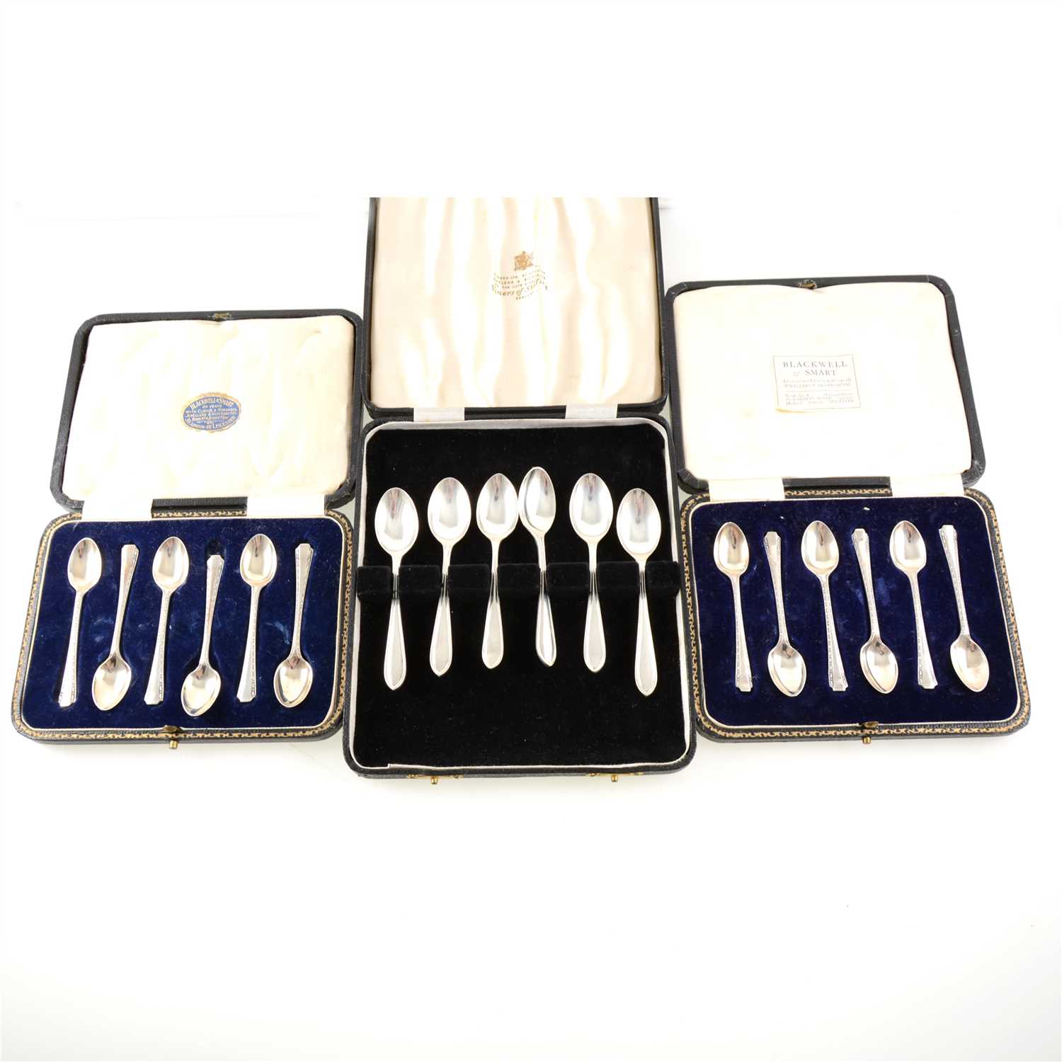 Lot 202 - A cased set of six silver teaspoons by Viner's Ltd (Emile Viner), Sheffield 1961, another cased set by Cooper Brothers & Sons Ltd, Sheffield 1921, and two cased sets of six silver coffee spoons