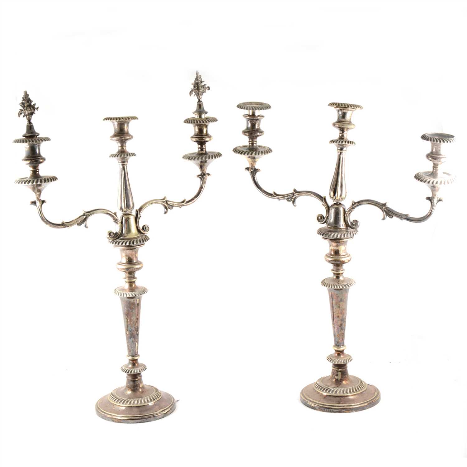 Lot 104 - A pair of tall electroplated three-light candelabra