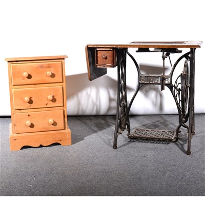 Lot 352 - A modern pine bedside chest, and a treadle sewing machine base