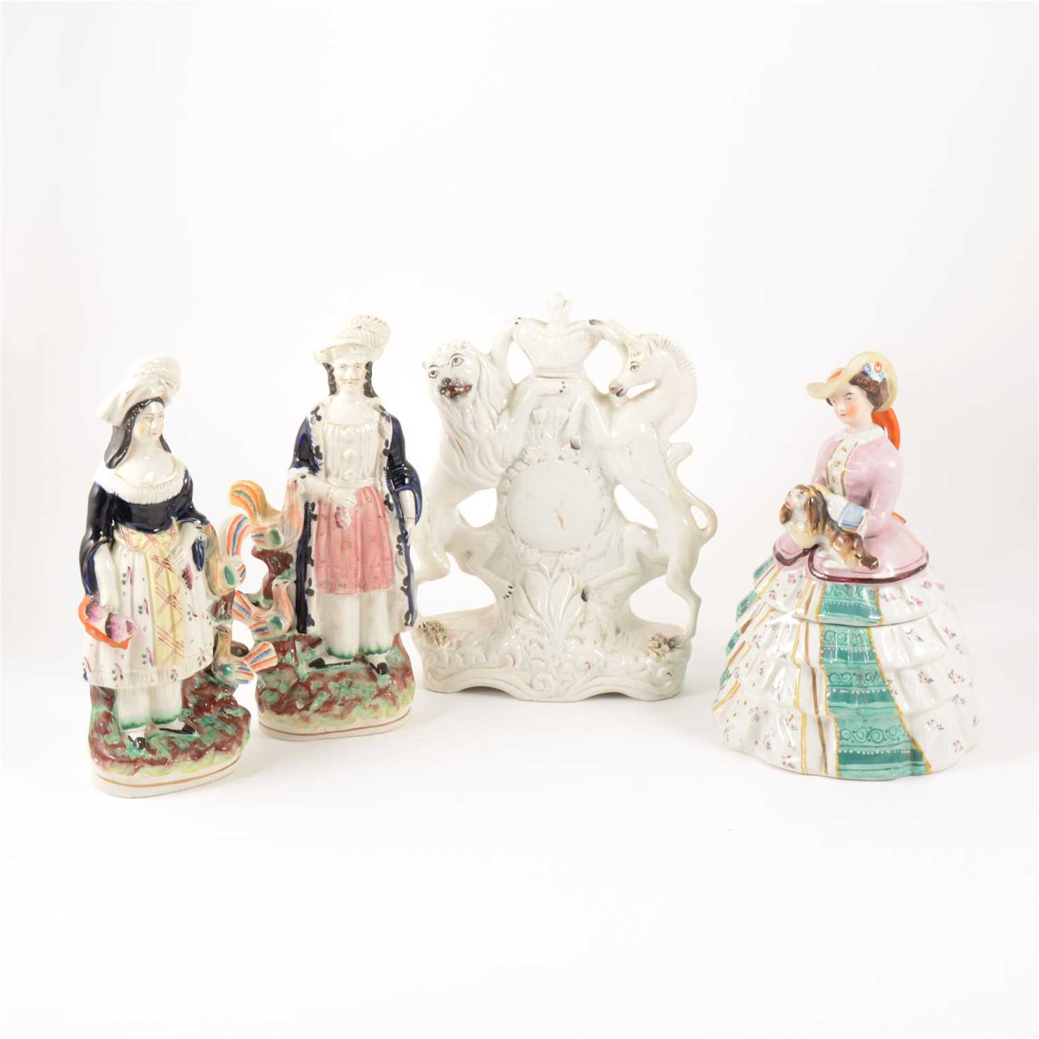 Lot 7 - A Staffordshire group, Queen Victoria and Baby, 20cm; and six other figures.