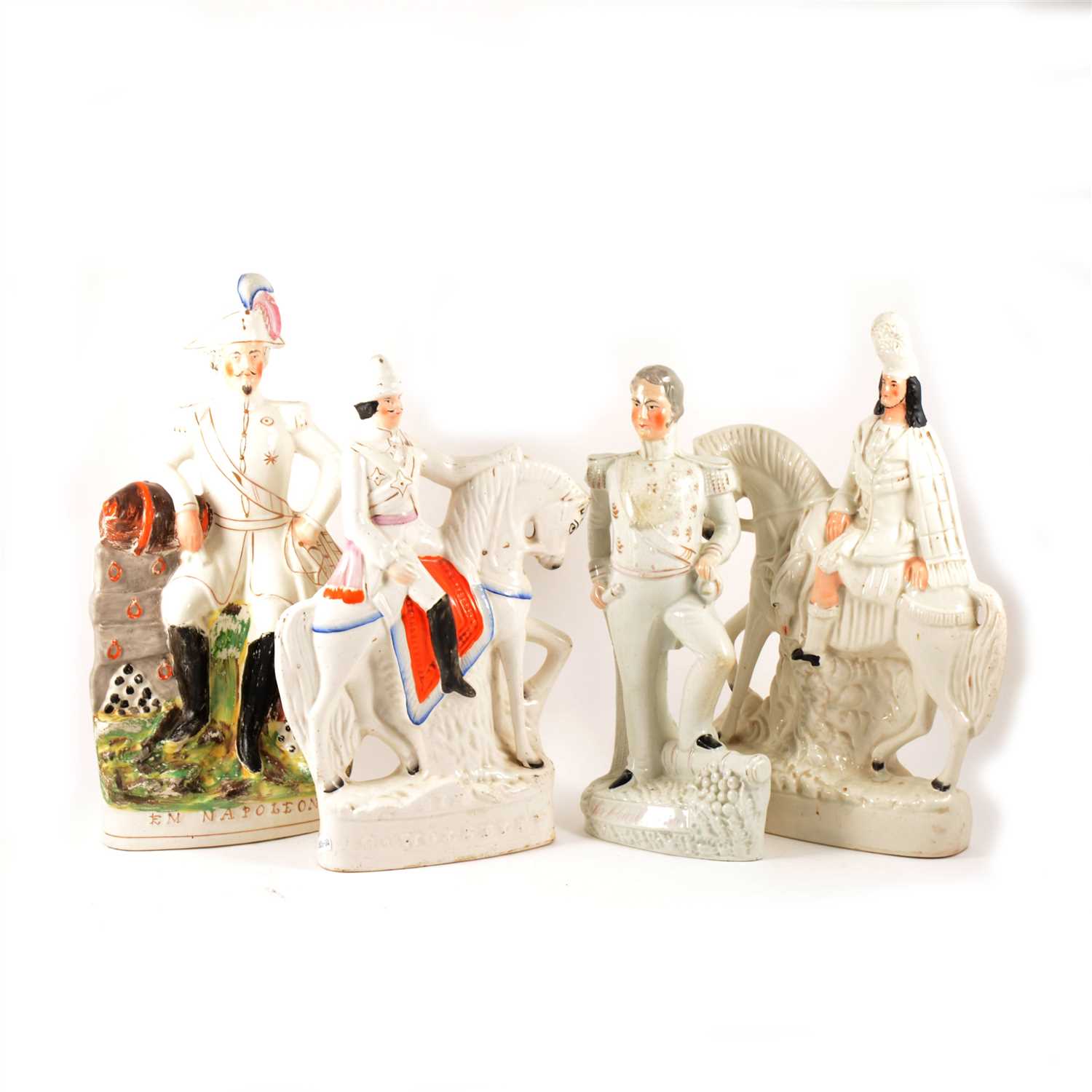 Lot 31 - A Staffordshire figure, Emperor Napoleon, and four other Staffordshire figures.