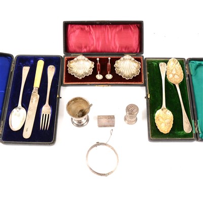 Lot 247 - A pair of silver berry spoons, London 1834, a cased condiment set, scallop shaped on three feet by William Aitken, Chester 1900, an egg cup marked 900S and other small silver items