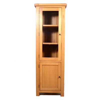 Lot 556 - Contemporary light oak freestanding corner cupboard