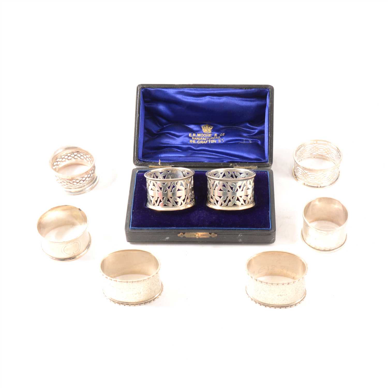 Lot 243 - Fifteen silver napkin rings including a cased pair, various dates and makers including Chester