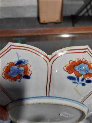 Lot 20 - Four Imari shallow bowls, lotus leaf shape, decorated in blue and iron red.