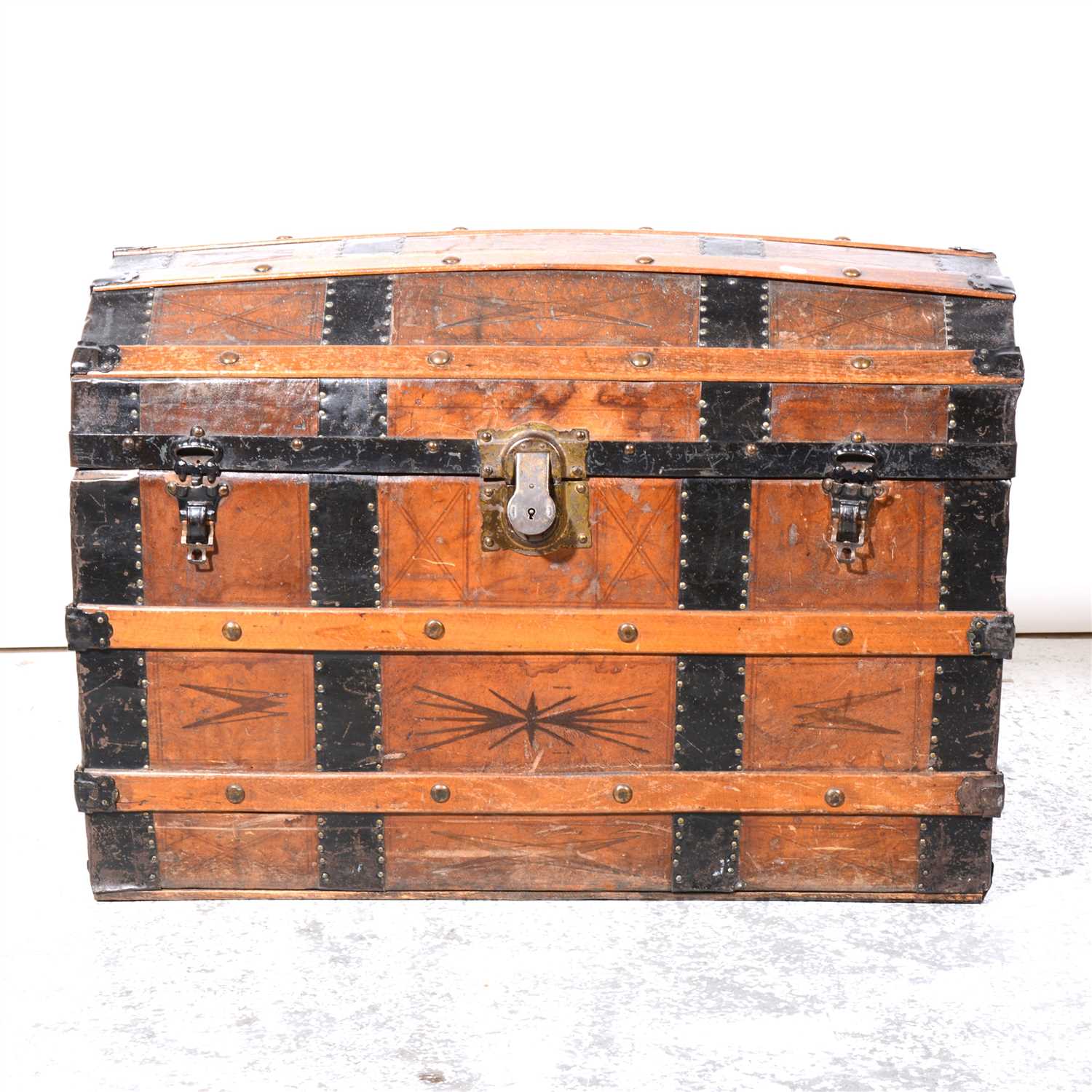 Lot 356 - Vintage leather and metal strapped dome-topped trunk.