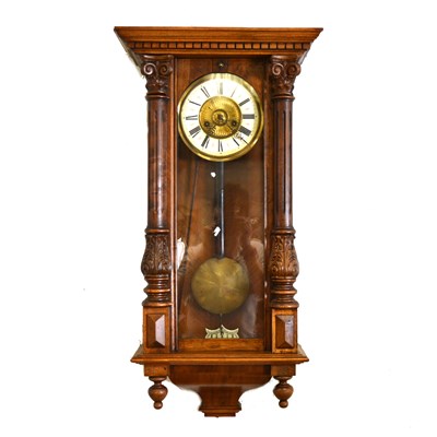 Lot 573 - A Vienna stained beechwood wall clock, ...