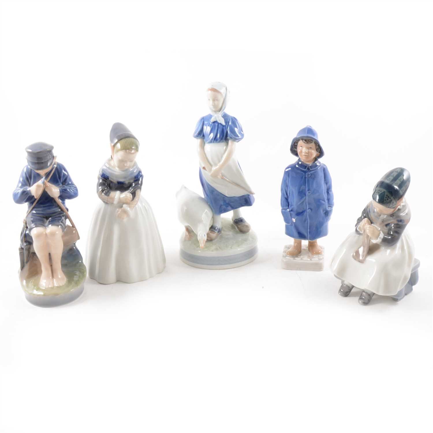 Lot 33 - Royal Copenhagen, figure of a boy in a raincoat no. 532, 18cm; similar figure, no. 3556; together with a collection of Royal Copenhagen and Bring & Grondahl figures, animal models, etc.