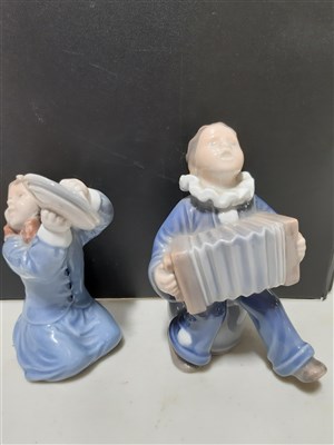 Lot 33 - Royal Copenhagen, figure of a boy in a raincoat no. 532, 18cm; similar figure, no. 3556; together with a collection of Royal Copenhagen and Bring & Grondahl figures, animal models, etc.