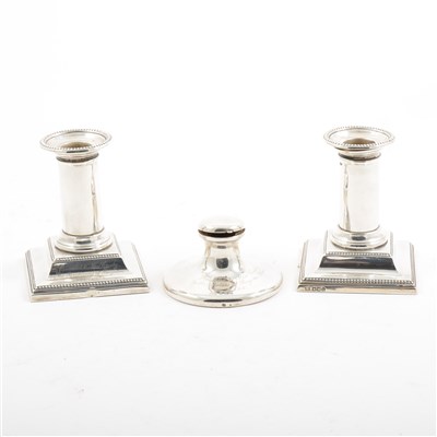 Lot 254 - A pair of silver candlesticks and capstan ink well