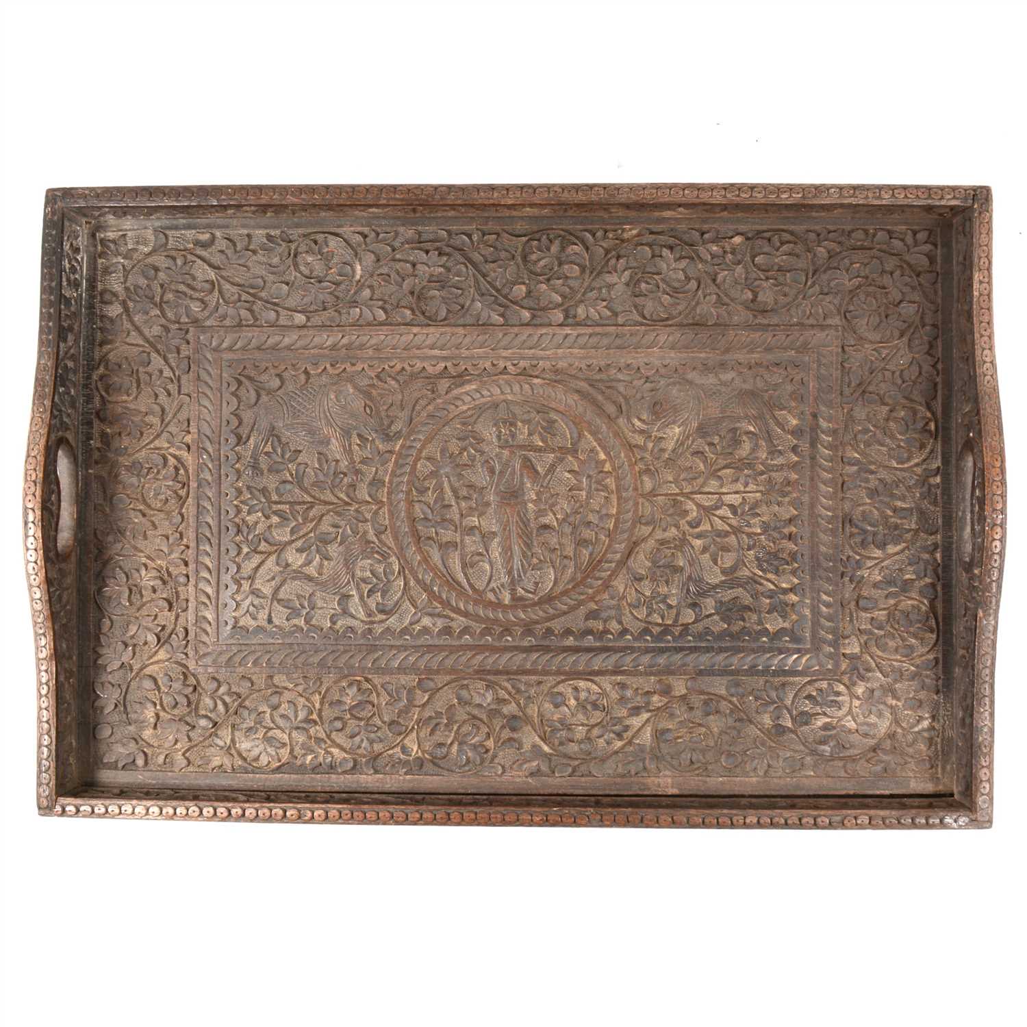 Lot 70 - An Eastern carved wooden tea tray, assorted glassware, and embroidered panels.