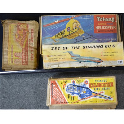 Lot 81 - Seven Tin-plate and plastic battery operated toys.