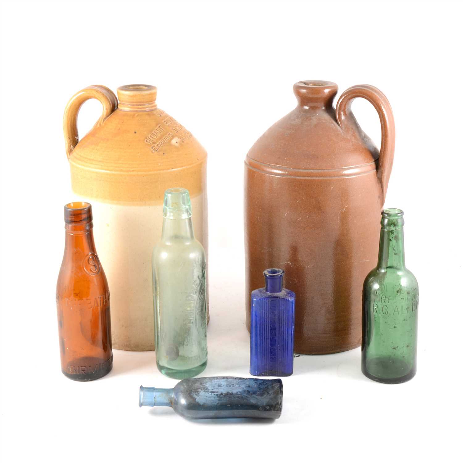 Lot 108 - A tray of old antique glass bottles to include blue poison bottles, Hunt Edmunds & Co Banbury flagon.