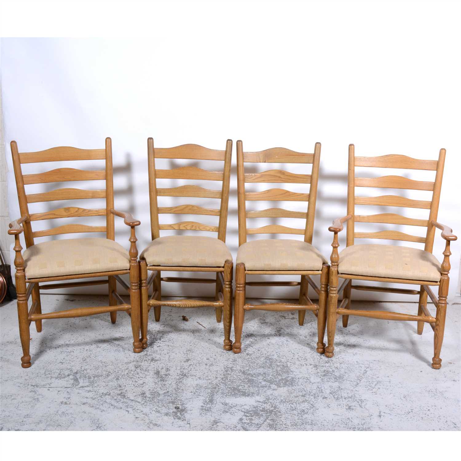 Lot 477 - Set of six elm and ash ladder-back dining chairs, comprising two elbow chairs, four single chairs, all with turned legs and rails, the elbow chairs 60cm, with a set of upholstered and cane drop-in....