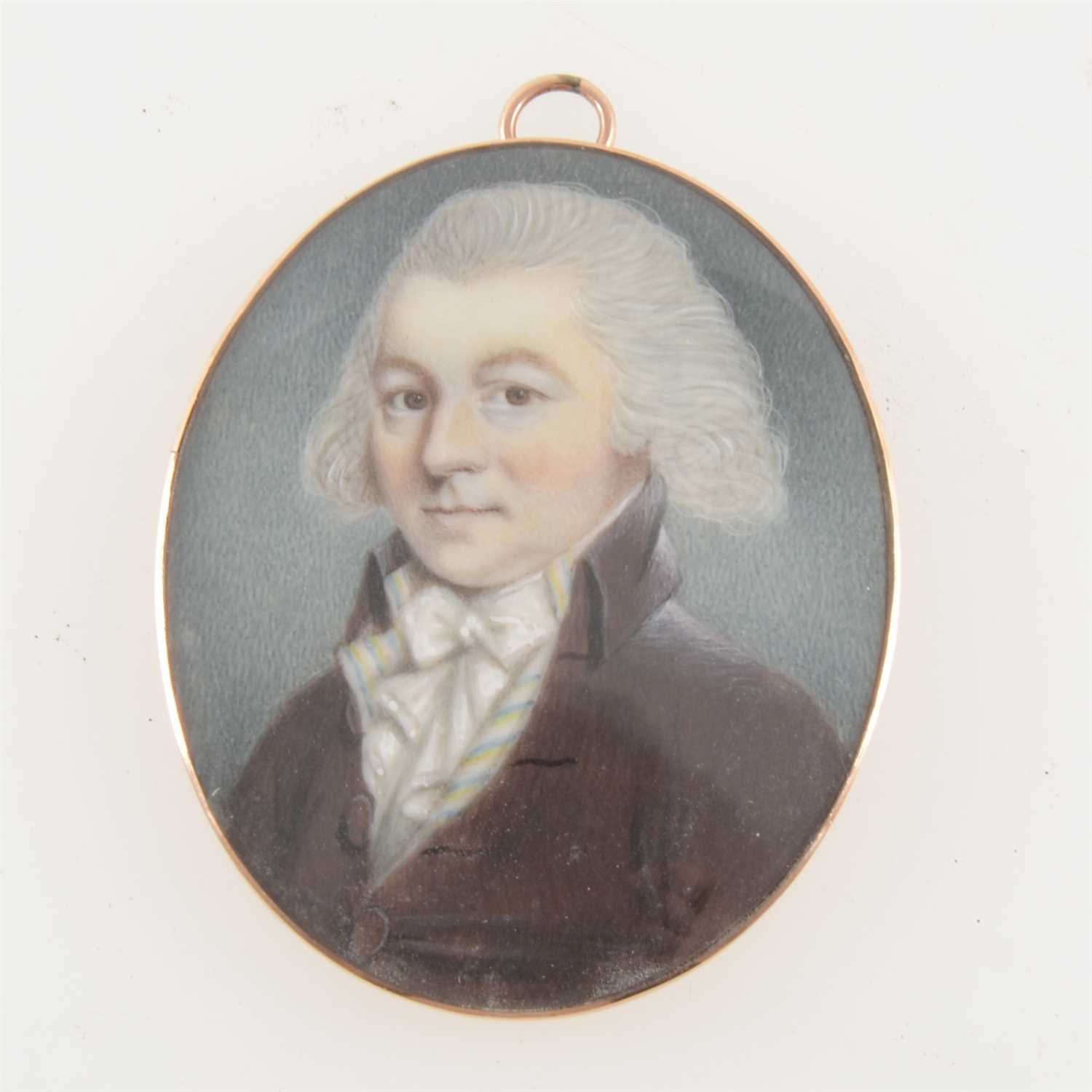 Lot 217 - English School, 19th Century, miniature portrait of a gentleman, head and shoulders, with a dark jacket and bow tie, unsigned, oval, 53mm x 43mm, yellow metal frame.