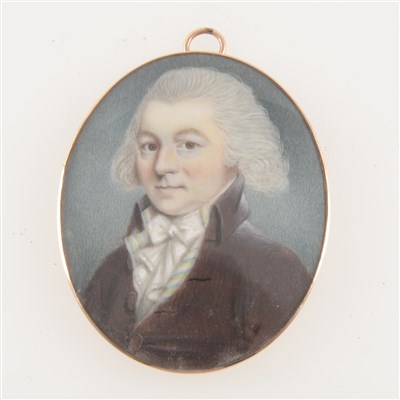 Lot 217 - English School, 19th Century, miniature portrait of a gentleman, head and shoulders, with a dark jacket and bow tie, unsigned, oval, 53mm x 43mm, yellow metal frame.