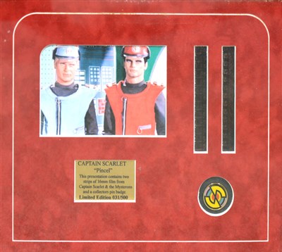 Lot 611 - Captain Scarlet and the Mysterons, a framed limited edition pin badge and film strip