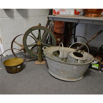 Lot 411 - Victorian treadle wheel, spare wheel, stirrup pump, a galvanised bath etc.