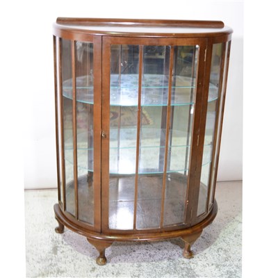 Lot 386 - 1930s walnut bowfront china cabinet