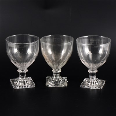 Lot 33 - Three similar George III rummers with lemon squeezer bases