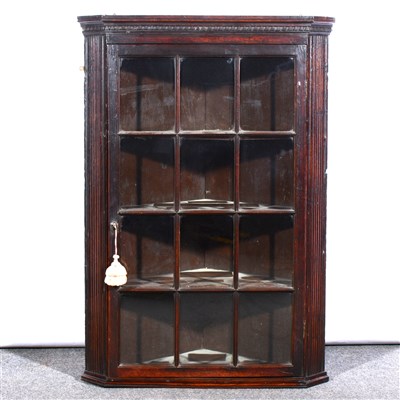 Lot 429 - George III oak hanging corner cupboard