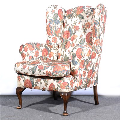 Lot 521 - A Parker Knoll wing-back easychair, floral print, ...