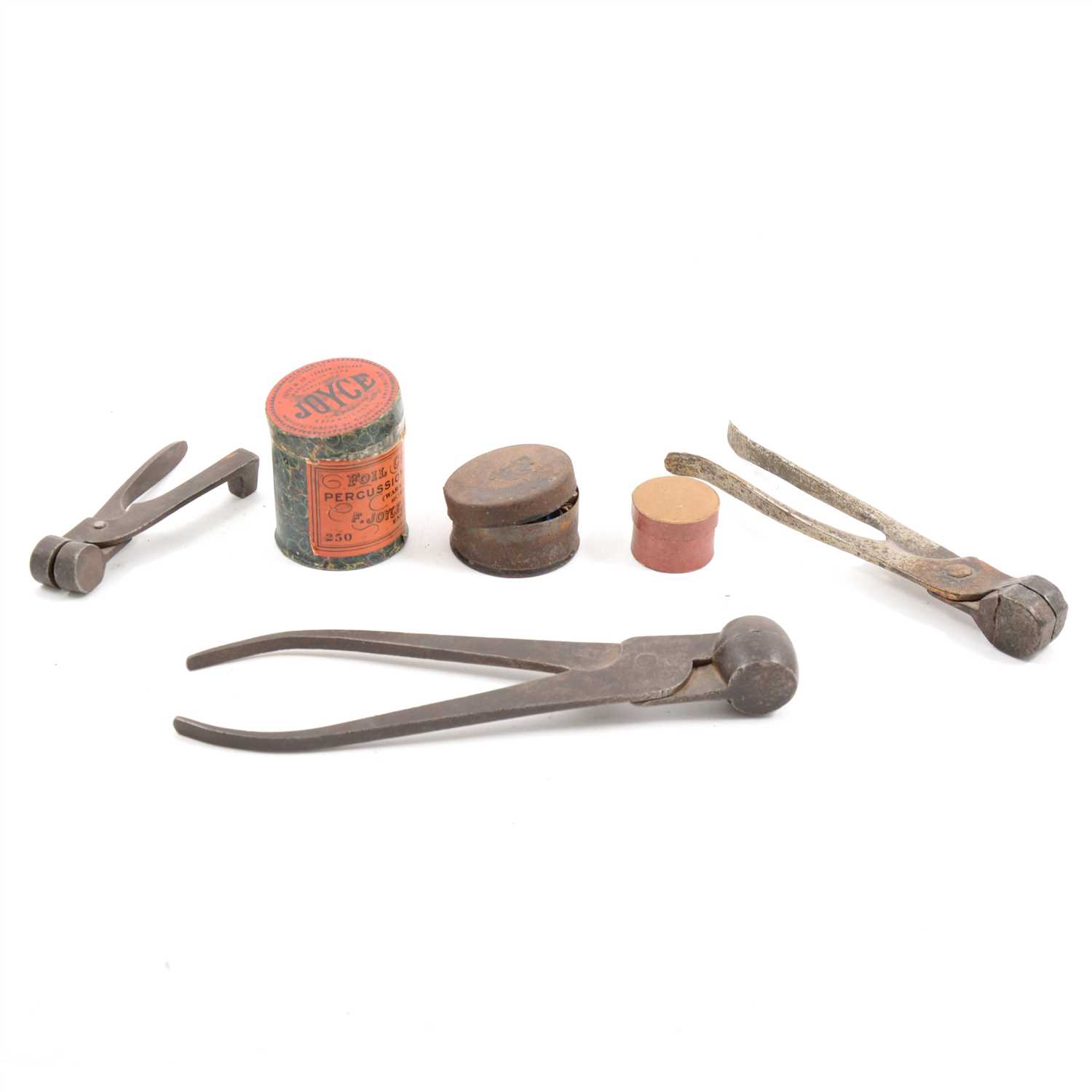 Lot 146 - Three bullet moulds, a tin of Joyce percussion foil caps, and another