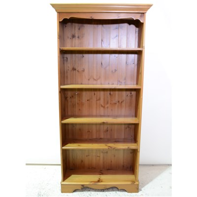 Lot 354 - A modern stained pine open bookcase, ...