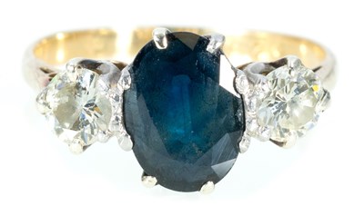 Lot 200 - A sapphire and diamond three stone ring