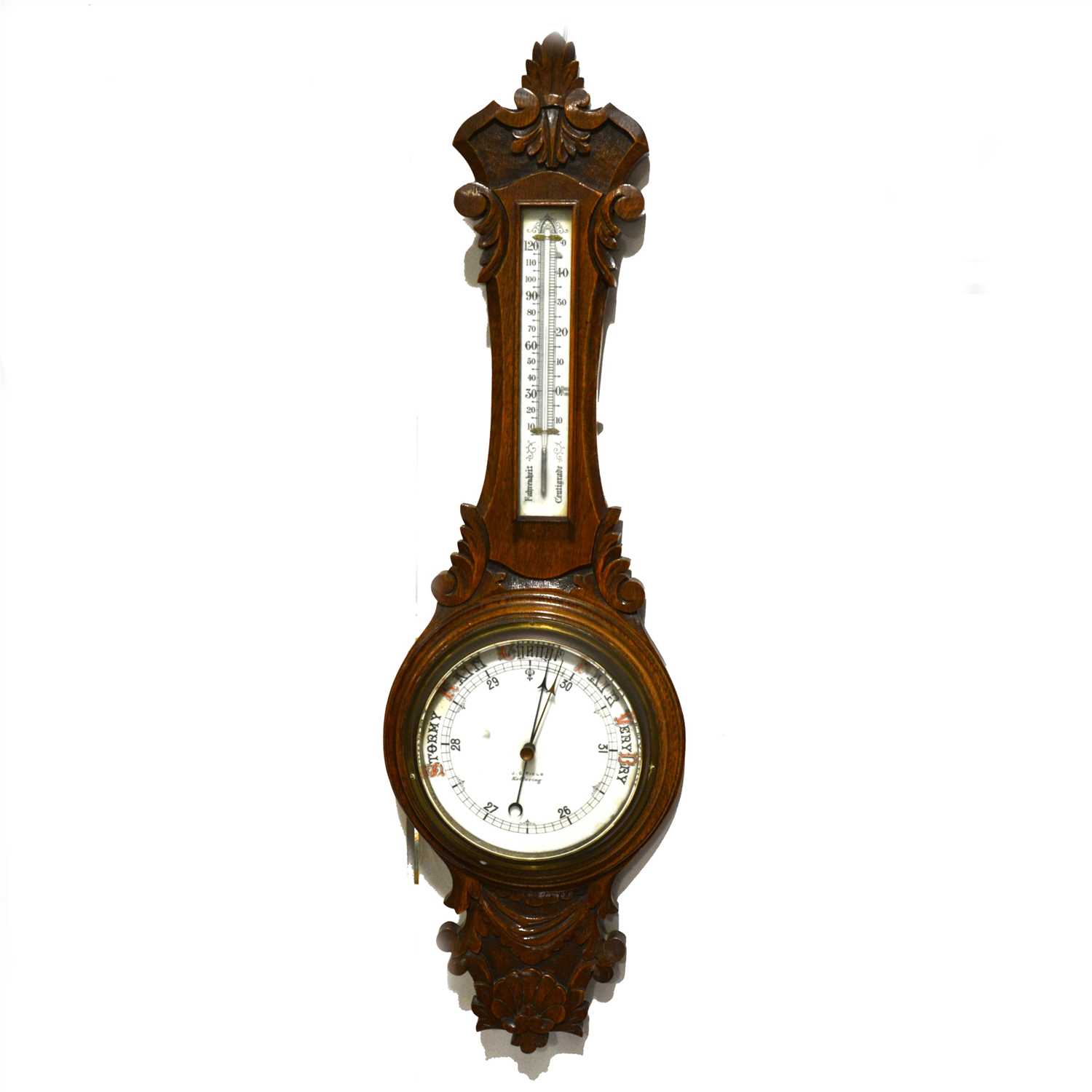 Lot 183 - Carved oak aneroid wall barometer, opaque dial, signed J. G. Field, Kettering