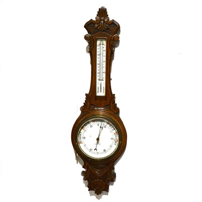 Lot 183 - Carved oak aneroid wall barometer, opaque dial, signed J. G. Field, Kettering