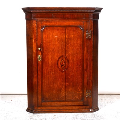 Lot 309 - George III oak mahogany hanging corner cabinet