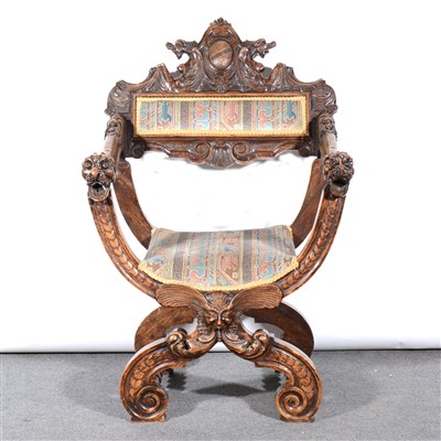 Lot 294 - An Italian Baroque style carved walnut elbow chair, ...