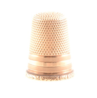 Lot 222 - A yellow metal thimble, marked 585