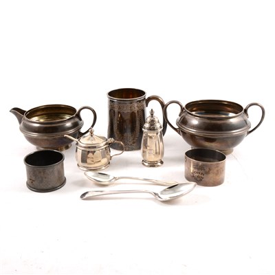Lot 194 - A small quantity of silver, to include a milk jug and sugar bowl by S W Smith & Co, a christening mug, six teaspoons, six coffee spoons etc.