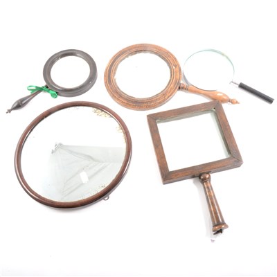 Lot 102 - A Victorian stained wood hand mirror, turned handle, and other mirrors and magnifying glasses