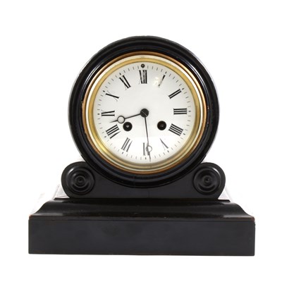 Lot 129 - A French ebonised mantel clock