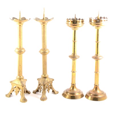 Lot 159 - A pair of Gothic Revival gilt metal candlesticks, and a pair of pricket candlesticks