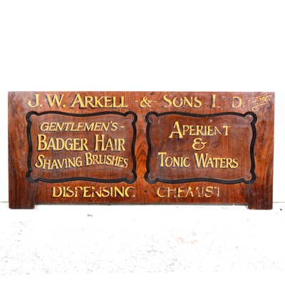 Lot 425 - A stained wood advertisement panel