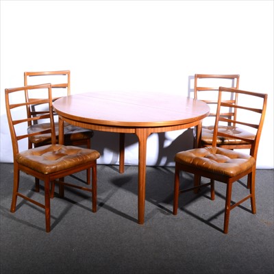 Lot 547 - An extending teak dining table and four chairs, circa 1976