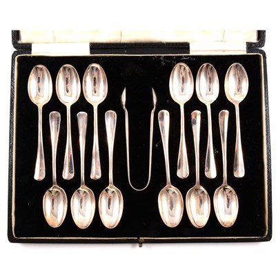 Lot 101 - Set of twelve silver teaspoons and matching sugar tongs, Josiah Williams & Co, London 1934
